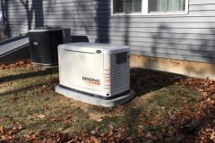 Generac home generator installed outside a house.