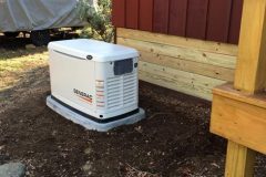 Generac home generator installed outside a house by PE Home Generators.