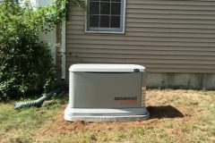 Generac home generator installed beside a house by PE Home Generators.
