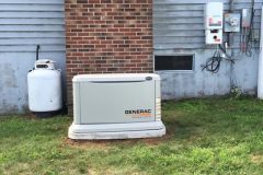 Generac home generator installed outside a house to provide emergency backup power.