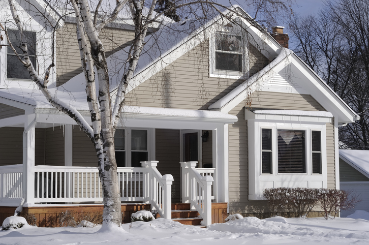 House in the suburbs covered in snow