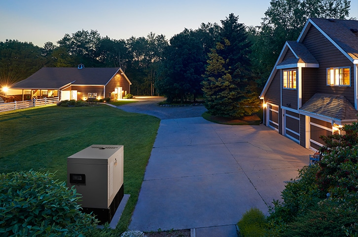 A modern suburban Connecticut home with an exterior whole-house generator operating beside the house.
